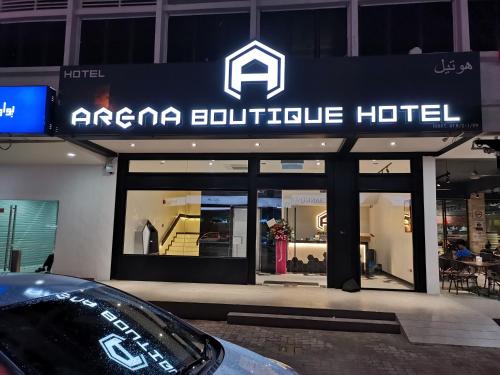 a car parked in front of an arena cubic hotel at ARENA Boutique Hotel Kuala Terengganu in Kuala Terengganu