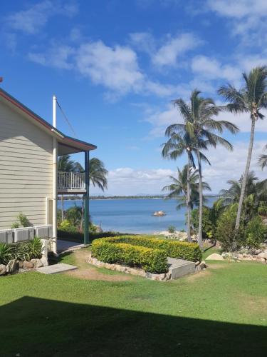 a house with a view of the ocean at Whitsunday Sands Resort in Bowen