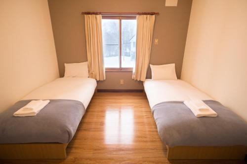 Cama o camas de una habitación en Annupuri Mountain View Lodge