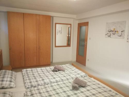 a bedroom with a bed with two pillows on it at patrick's Ferienwohnung in Glauburg
