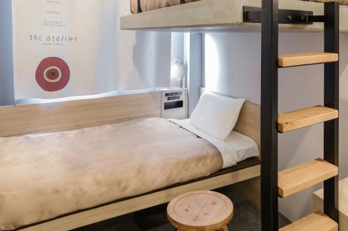 a bedroom with a bunk bed in a room at Sakura Terrace The Atelier in Kyoto