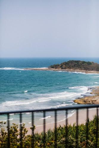 a view of the beach from a balcony at Pacific Hotel Yamba in Yamba