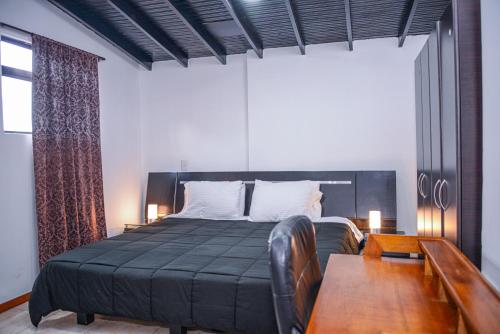 Postel nebo postele na pokoji v ubytování Apartment El Jeffe Medellin