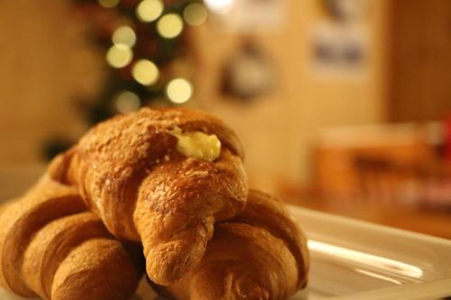 a close up of two pastries on a plate at Residence Weissthor in Macugnaga