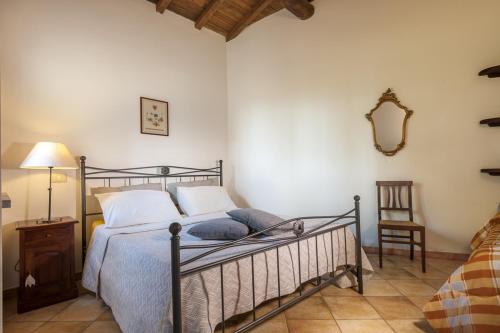 Poggio delle Api tesisinde bir odada yatak veya yataklar