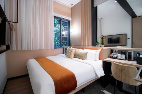Postel nebo postele na pokoji v ubytování Hotel NuVe Elements