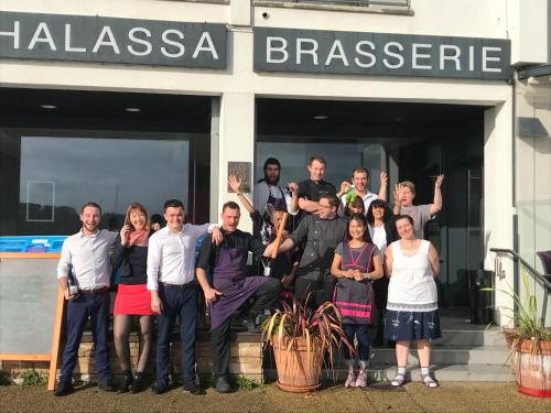 a group of people standing outside of a building at Le Thalassa Hôtel & Spa in Camaret-sur-Mer