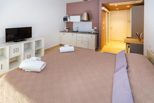 Postel nebo postele na pokoji v ubytování Zeus Hotel - Aparthotel - Meeting & Congress