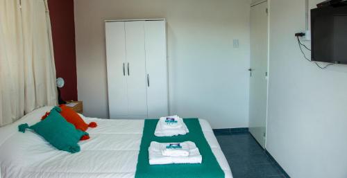 Łóżko lub łóżka w pokoju w obiekcie CasaGrande Hotel
