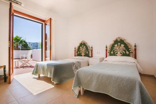 Säng eller sängar i ett rum på Villa Mumare