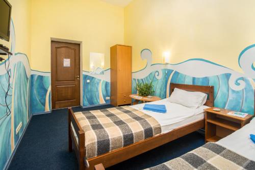 Кровать или кровати в номере Мини-отель Океан
