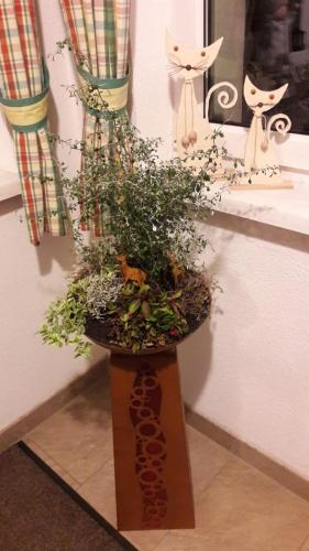 a plant in a wooden planter on a counter at Schusterbauernhof in Bad Mitterndorf