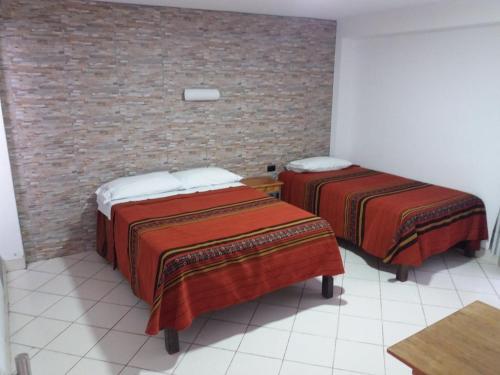 Cama o camas de una habitación en Hostal Fatima