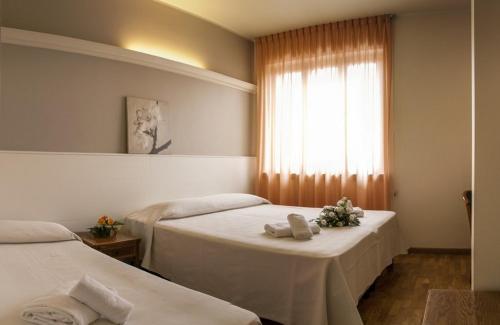 En eller flere senge i et værelse på Vesta Domus