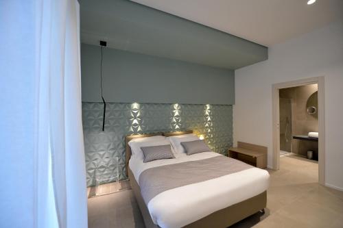 Una cama o camas en una habitación de All'ombra