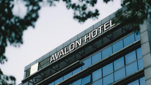 a building with a sign on top of it at Avalon Hotel & Conferences in Rīga