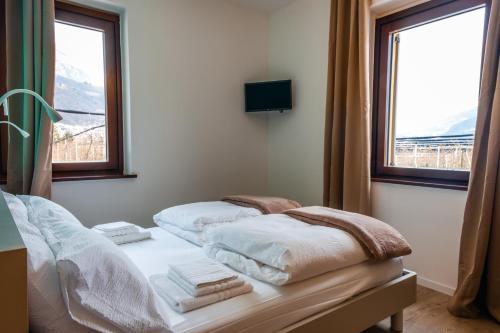 Postel nebo postele na pokoji v ubytování Agriturismo La Casa Gialla