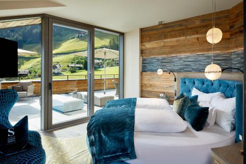 A bed or beds in a room at Chalet SALENA luxury lodge