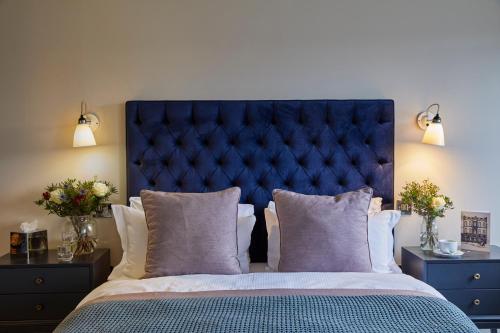 A bed or beds in a room at Hertford House 