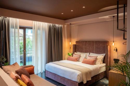 Ένα ή περισσότερα κρεβάτια σε δωμάτιο στο Olympus Terra Boutique Hotel