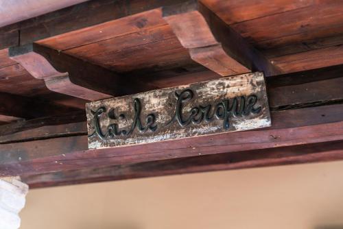 a sign on the ceiling of a wooden ceiling at Ca' le cerque, villa surrounded by the Marche nature in Fossombrone