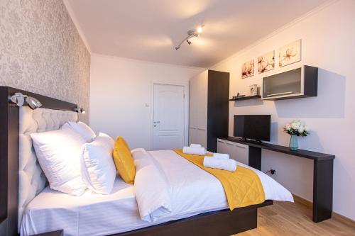 En eller flere senge i et værelse på ONYX - Wonder Aparthotel