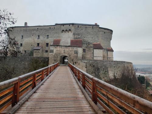 a bridge in front of a castle with a building at Ferienwohnung Ponlach in Tittmoning