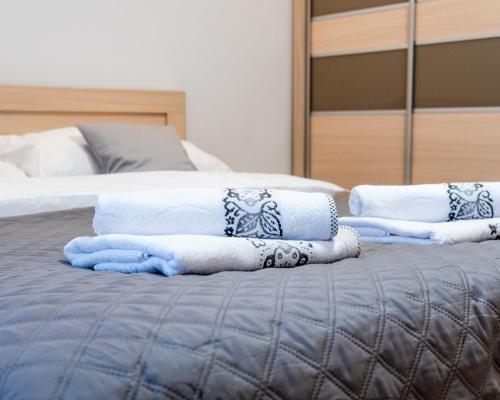 Un pat sau paturi într-o cameră la Apartament Relax