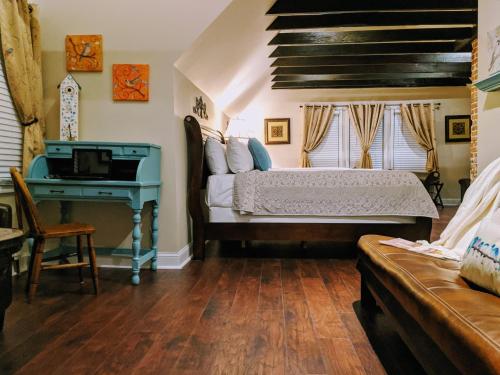a bedroom with a bed and a piano at Chelsea Pub and Inn in Atlantic City