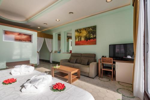 a hotel room with two beds and a flat screen tv at Llar de Capitans in El Masnou