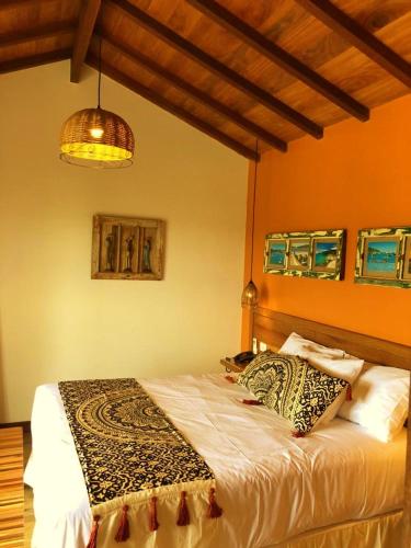 Ένα ή περισσότερα κρεβάτια σε δωμάτιο στο Pousada Villa Canaã