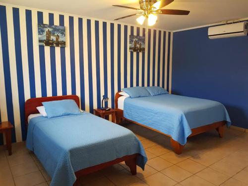 Postel nebo postele na pokoji v ubytování Hotel Grosseto Palma Real