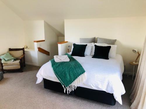 Ein Bett oder Betten in einem Zimmer der Unterkunft Le Grá Vineyard and Winery