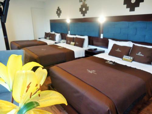 En eller flere senge i et værelse på San Francisco Cusco Hotel