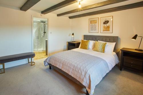 a bedroom with a bed and a television in it at Host & Stay - The Coach House in Whitby