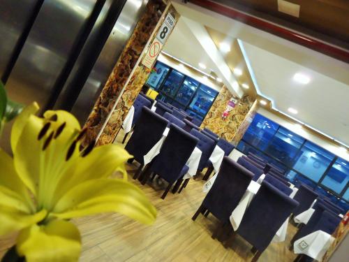 a room with chairs and a bunch of bananas at San Francisco Cusco Hotel in Cusco