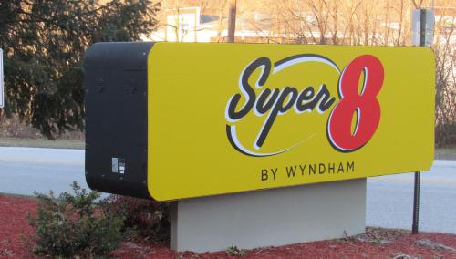 a sign for a super by wynatown at Super 8 by Wyndham New Cumberland in New Cumberland