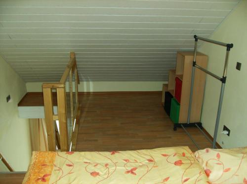 a bedroom with a staircase and a bed in a room at Järgen Ferienappartements in Koblenz