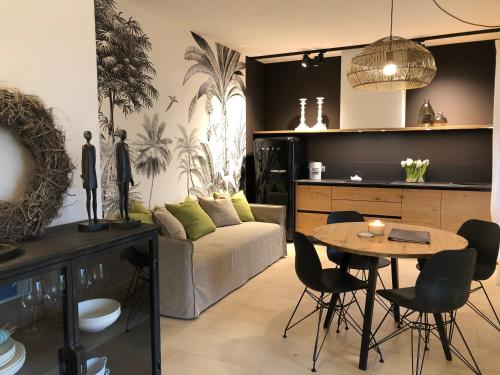 a living room with a table and a couch at Residence Relais Cà dell'Era in Tremosine Sul Garda