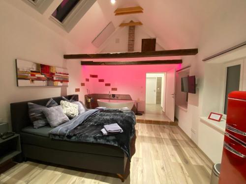 a bedroom with a bed and a bath tub at Auszeit Vienna Wellness Apartment in Vienna