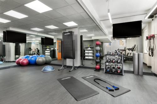 a gym with a lot of balls and equipment at Hotel 57 by LuxUrban in New York