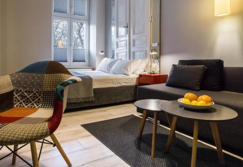 a living room with a couch and a table at Yourplace M57 Apartments in Krakow