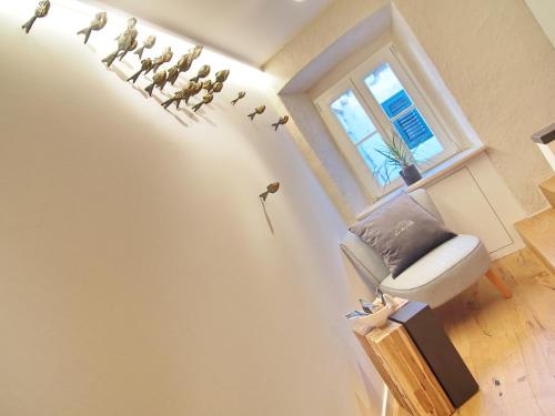 a group of birds on the wall of a room at La Vita e Bella IV in Dubrovnik