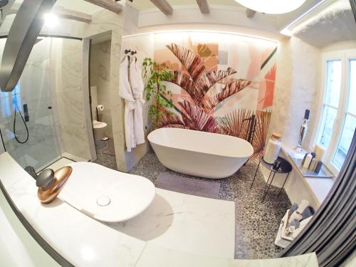 a bathroom with a bath tub and a sink at La Vita e Bella IV in Dubrovnik