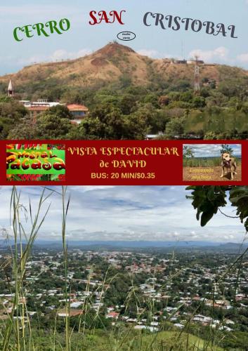 a sign on top of a hill with a city at PaCasa Hostel in David