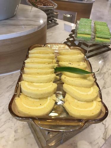 a tray of bananas and celery on a counter at Sun Kiss Hotel in Nha Trang
