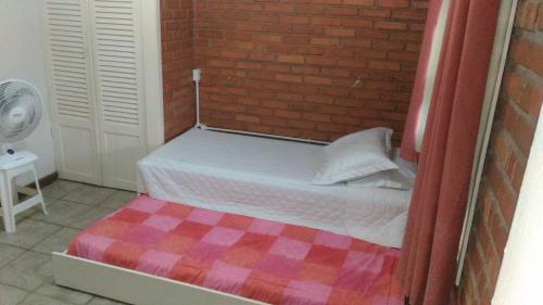 Postel nebo postele na pokoji v ubytování Pousada Casa de Praia