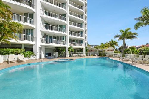 a large swimming pool in front of a large building at Crystal Bay On The Broadwater in Gold Coast