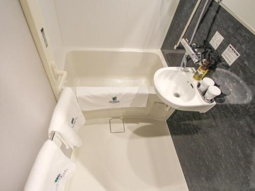 A bathroom at Hotel Livemax Osaka Kadoma
