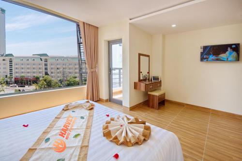 Giường trong phòng chung tại Harvey Hotel & Apartments